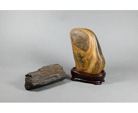 A Chinese scholar's rock, gongshi, of rugged mountain form with dramatic textured surface, 12.5 cm high to/w another light br