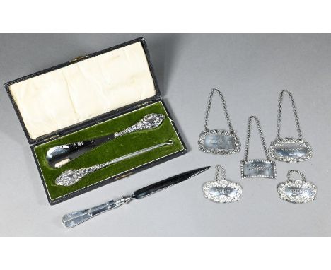 Five various silver decanter labels, silver-handled letter-knife and a cased button hook and shoe horn with silver handles