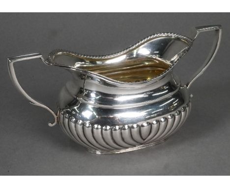 A late Victorian half-reeded silver sugar basin with twin handles, Hawksworth Eyre &amp; Co, London 1900, 5.8oz (182g)