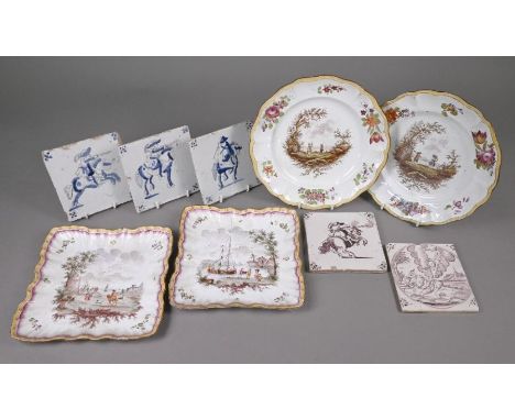 A pair of French faience plates, bearing marks of Savy's factory (Marseilles c. 1770-90), painted with rustic couples in land