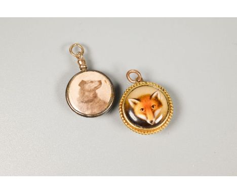 A Victorian enamel fox pendant, of circular form, the polychrome enamel painted fox's head within a beaded gold surround, the