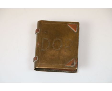 A WW1 Trench Art lighter in the form of a book.