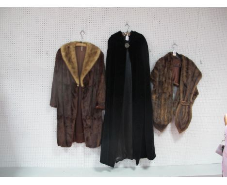 A Vintage Ankle Length Black Velvet Cloak by 'Richard Shops'; a knee length fur coat with mink collar and two fur stoles. (4)