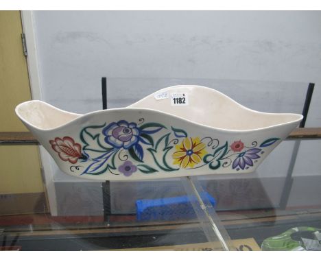 A Poole Posy, of wavy form with stylized flowers, together with a Poole jug with stylized flowers.