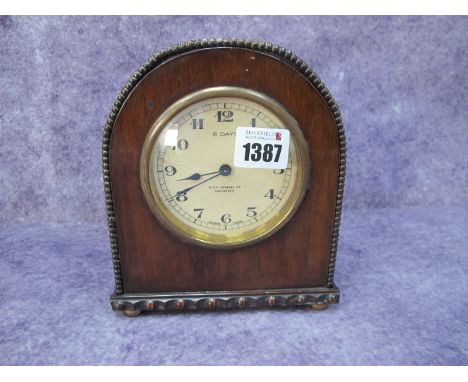 A 1930's Eight Day Mantel Clock, (City Jewellery Co, Doncaster) with beadwork decoration, gilded brass feet.