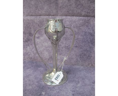An Art Nouveau Cast Pewter Candlestick, by R.E Williams of Birmingham, having twin loop handles and stylized leaf decoration,