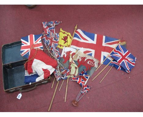 A Union Jack Flag, Welsh Flag on a stick, etc, in a brown case.