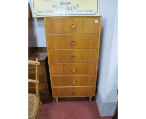 A Light Oak and Teak Oak Slender Chest, circa 1960's, with concave turned handles, to six drawers, on tapering tubular legs, 