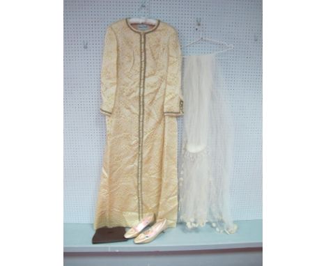 A c.1960's Susan Small Full Length Cream and Gold Thread Gown (used as a wedding dress) with centre front button detail conce