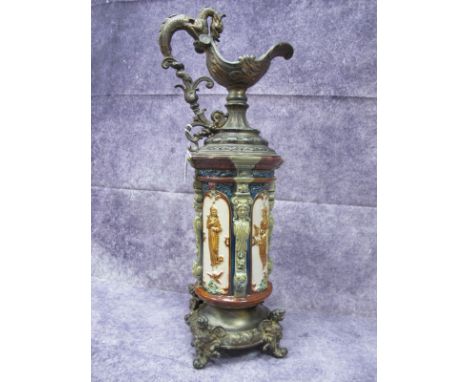 Decorative Ornament in The Form of an Ewer, having cylindrical majolica ceramic body depicting classical ladies, gilded metal