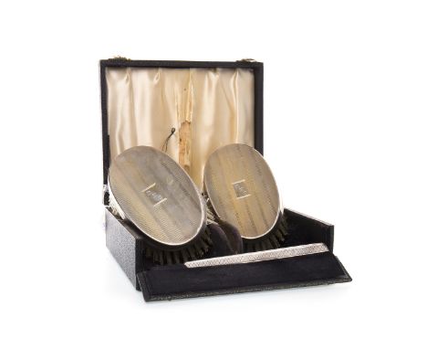 ELIZABETH II SILVER MOUNTED BRUSH SET maker W I Broadway & Co., Brimingham 1954, comprising two oval hairbushes and the silve