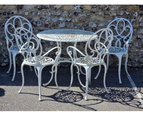 Garden Furniture: a white painted aluminium circular table, 84.5cm diameter; four matching chairs; and a similar bench, 119cm