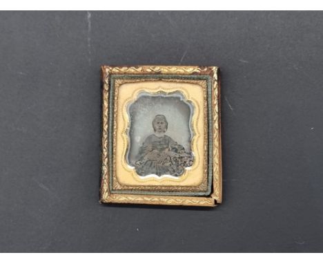 (SJM) An unusually small Victorian daguerreotype, of a young lady, embossed verso 'W Boswell, Photographer, Norwich', the who