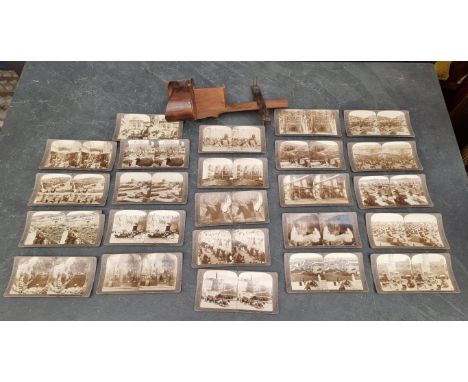 A handheld stereoscopic viewer; together with twenty four Underwood &amp; Underwood cards. 