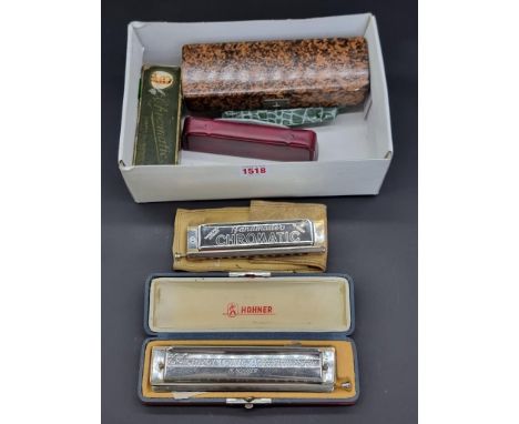 Seven mouth organs, to include six Hohner examples.