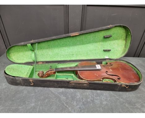 An antique Continental violin, labelled 'Antonius Stradivarius, Deutsche Arbeit, 1886', with 14in two-piece back, in ebonized
