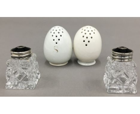 A pair of Norwegian sterling silver, black enamel and glass cruets, together with a pair of egg shaped pottery cruets, impres