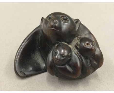 A Japanese carved wooden netsuke