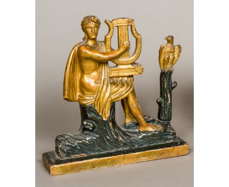 An 18th/19th century Continental carved giltwood and ebonised figure of a classical female playing a lyre, modelled seated on