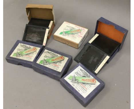 A small quantity of glass projector slides