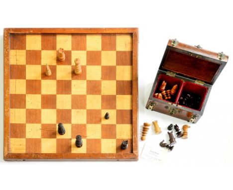 A VICTORIAN TURNED BOXWOOD AND ROSEWOOD CHESS SET, KINGS 8CM H, IN A VICTORIAN WALNUT TEA CADDY WITH BRASS STRAPWORK AND A CO