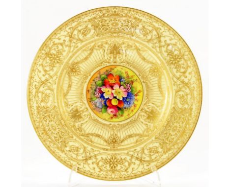 A ROYAL WORCESTER PLATE WITH CENTRAL FLOWER PANEL ON PRIMROSE AND GILT GROUND,M PUCE PRINTED MARK AND BURLEY & CO CHICAGO