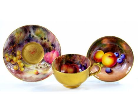 A ROYAL WORCESTER TEACUP AND SAUCER, PAINTED BY H. MARTIN, BOTH SIGNED, WITH FRUIT ON A WOODLAND BANK AND GILT, SAUCER 12.5CM