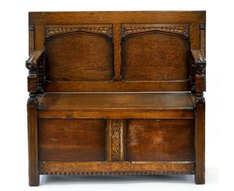 A CARVED OAK MONK'S BENCH, 108CM W
