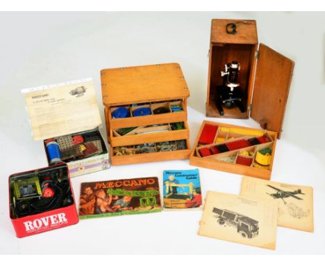 A QUANTITY OF VINTAGE MECCANO  IN AND HOMEMADE LIGHT WOOD CHEST OF DRAWERS AND TWO BISCUIT TINS AND AN ITALIAN MICROSCOPE, OA