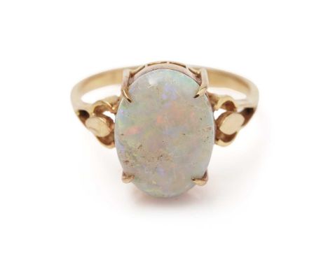 An opal cabochon dress ring, on yellow gold shank, ring size O, 3.4g gross. 