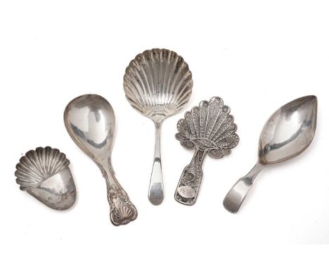 A George III silver filigree work caddy spoon; three other antique silver caddy spoons; and a caddy spoon bowl. (5)