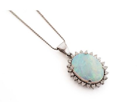 An opal and diamond pendant, the oval opal cabochon, surrounded by a diamond bezel, in 14ct white gold mount, on 18ct white g