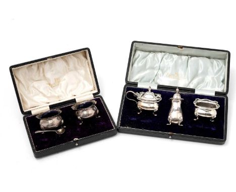 A pair of silver table salts, by Walker &amp; Hall, Birmingham 1923, cased; and a set of three silver condiments, by Walker a