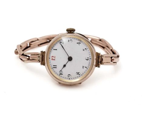 A 9ct gold cased wristwatch, enamel arabic dial with manual wind movement and flexible strap, 20.0g gross. (ticking over at t