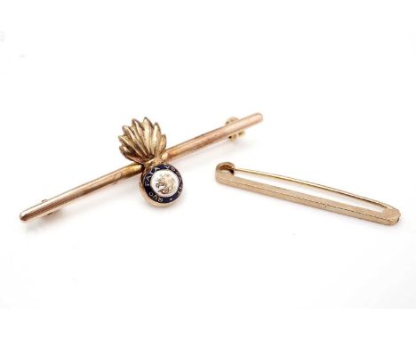 A 15ct gold Northumberland fusiliers sweetheart brooch, with enamel highlights, 5.8g gross; and a 9ct yellow gold tie pin, 1.