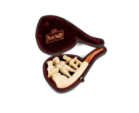 A 19th Century carved meerschaum pipe, in the form of a bulldog showman in top hat, with amber mouthpiece, cased.
