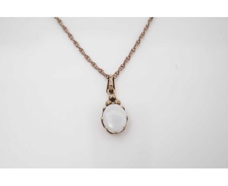 An opal pendant, in 9ct yellow gold mount and twist link chain. 