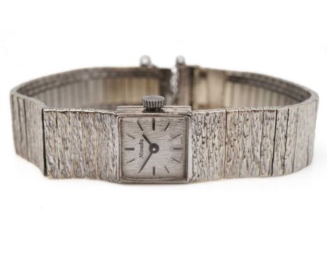 A Nivada 9ct white gold cocktail watch, baton dial with manual wind movement (running at time of inspection), with textured g