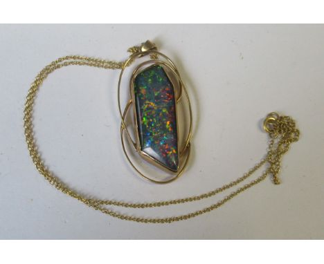 A yellow gold mounted synthetic opal pendant, on fine chain, weight 6.5g&nbsp;