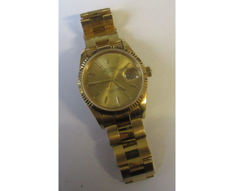 A Rolex 18k Oyster Perpetual Date chronometer wrist watch, with champagne dial, ref number 78353, watch model ref 15238, tota