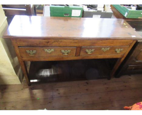 An Antique oak dresser, with two frieze drawers, raised on tapering legs united by shelf below, width 52ins, height 33ins, de