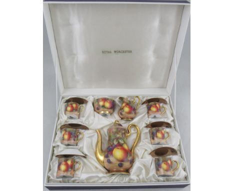 A Royal Worcester cased coffee set, comprising six coffee cans and saucers, a coffee pot, a milk jug and a sugar bowl, all de