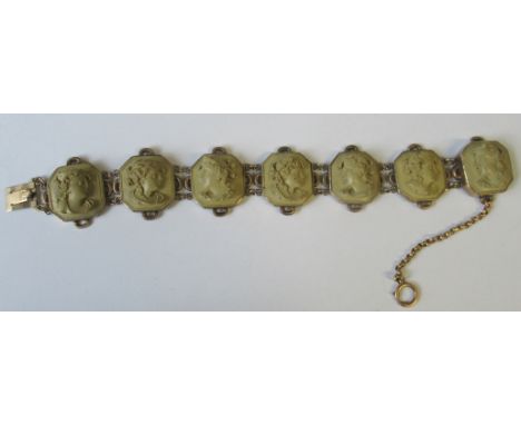 A Victorian lava cameo bracelet, of seven links, each with bust portrait, yellow metal mounts, unmarked&nbsp;