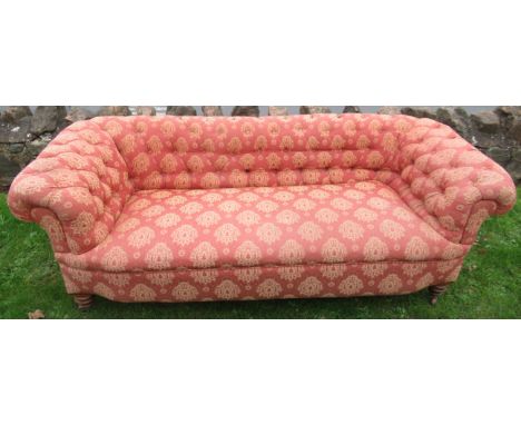 A two seat roll top Chesterfield settee&nbsp;