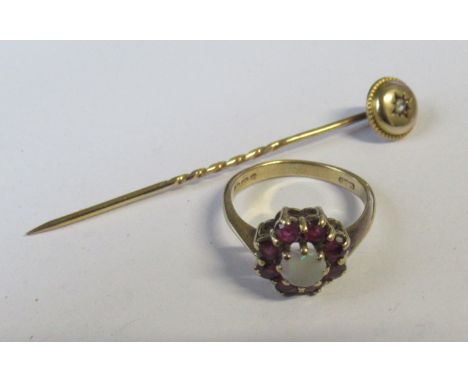 A 9ct opal and garnet cluster ring, together with a gold stick pin, set rose cut diamond, in case&nbsp;
