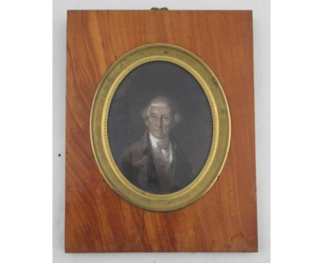 A 19th century Empire style, oval portrait of be-wigged man, maximum diameter 5.5ins