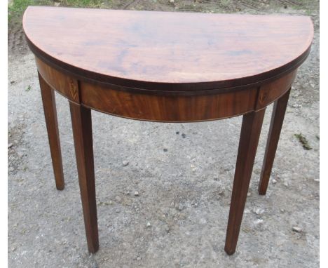 An 19th century mahogany fold over card table, with cross banded top, raised on four square topped legs, width 35ins, depth 1