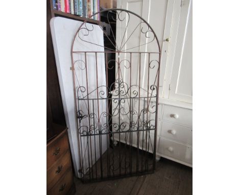 An arched iron gate width 38ins, height approx 76ins, together with another width 35.5ins, height 50ins&nbsp;