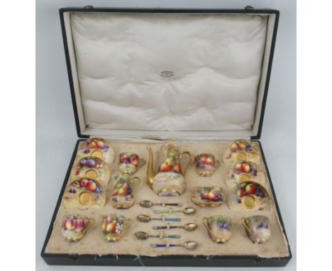 A cased Royal Worcester coffee set, comprising six coffee cups and saucers, a coffee pot, a milk jug and a shaped sugar bowl,