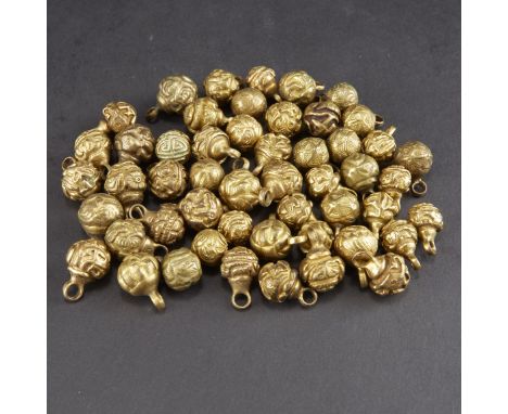 Collection of 51 gilt bronze Chinese robe buttons, most likely Qing Dynasty. Some decorated with geometric motifs and flower 